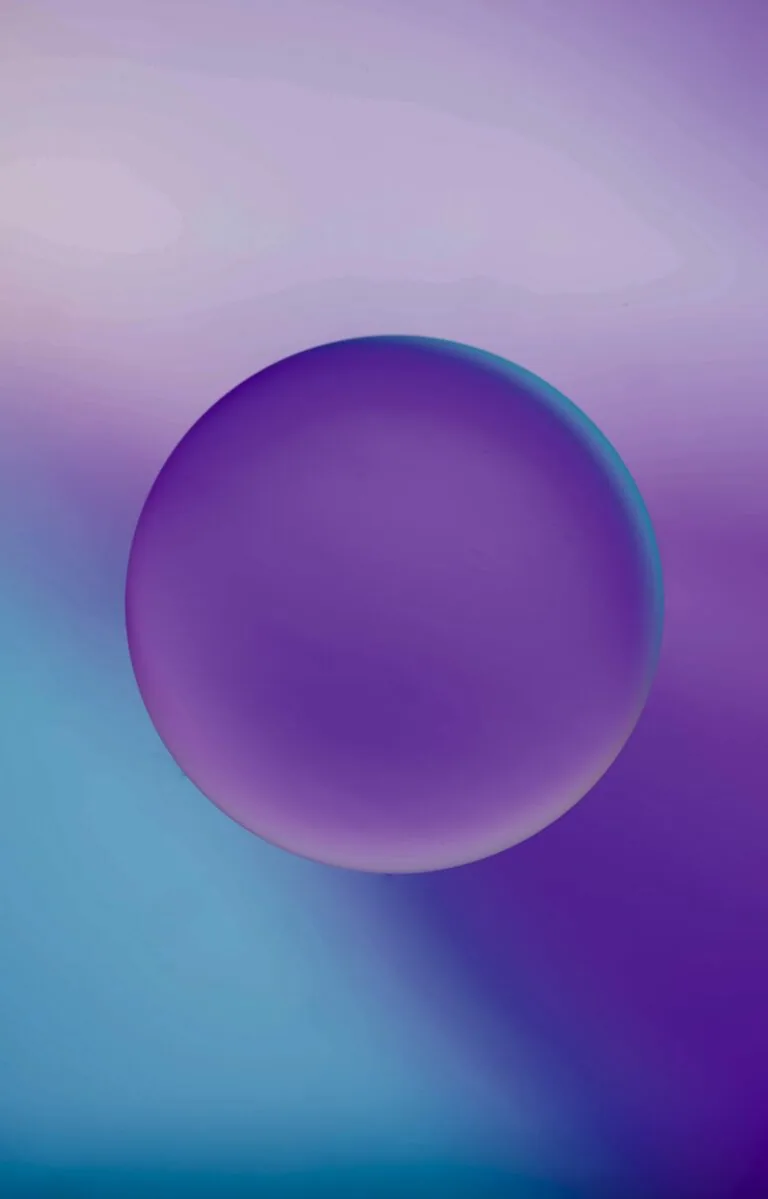 Purple sphere with gradient shadow on purple and blue gradient background